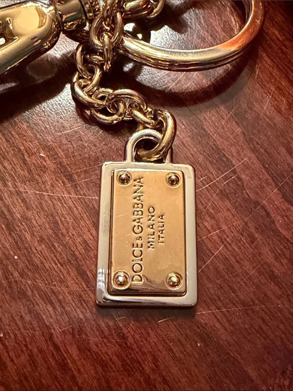 Dolce & Gabbana Orange  Mink Fur Pom-Pom Keychain with Black Leaf Accent